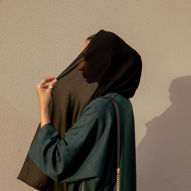 Model wearing a black hijab scarf